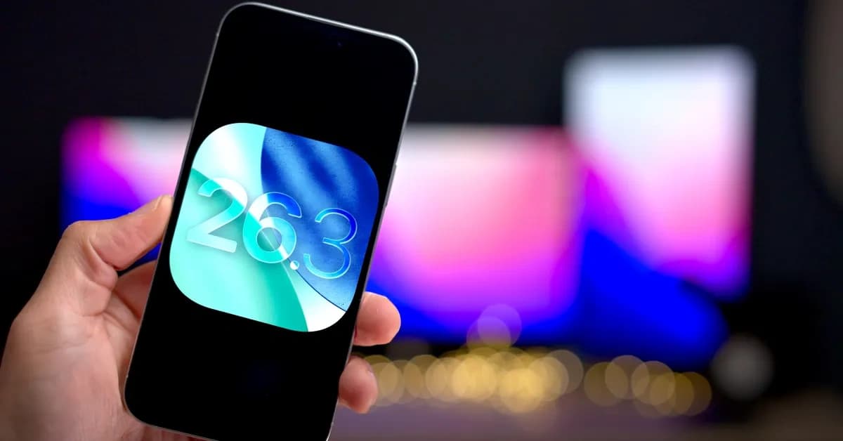 iPhone displaying the iOS 26.3 update screen against a colorful blurred background.