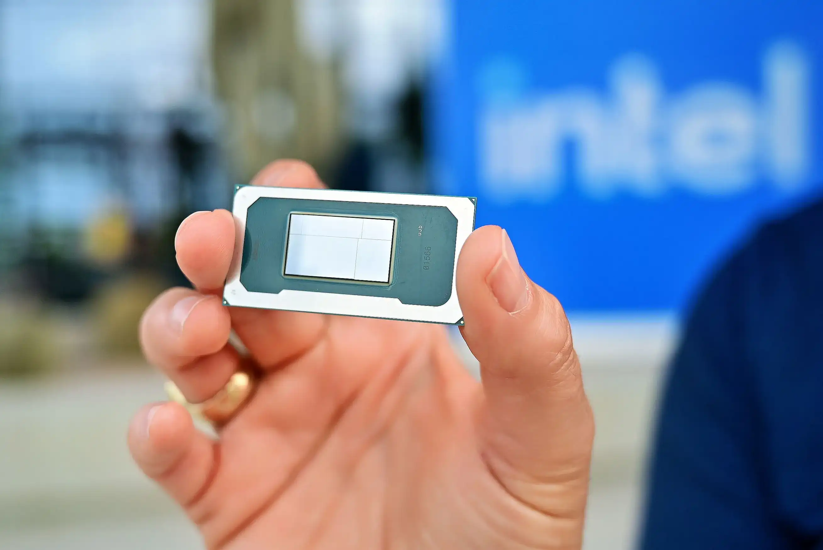 Close-up of an Intel Panther Lake chip held in hand, highlighting the processor die design.