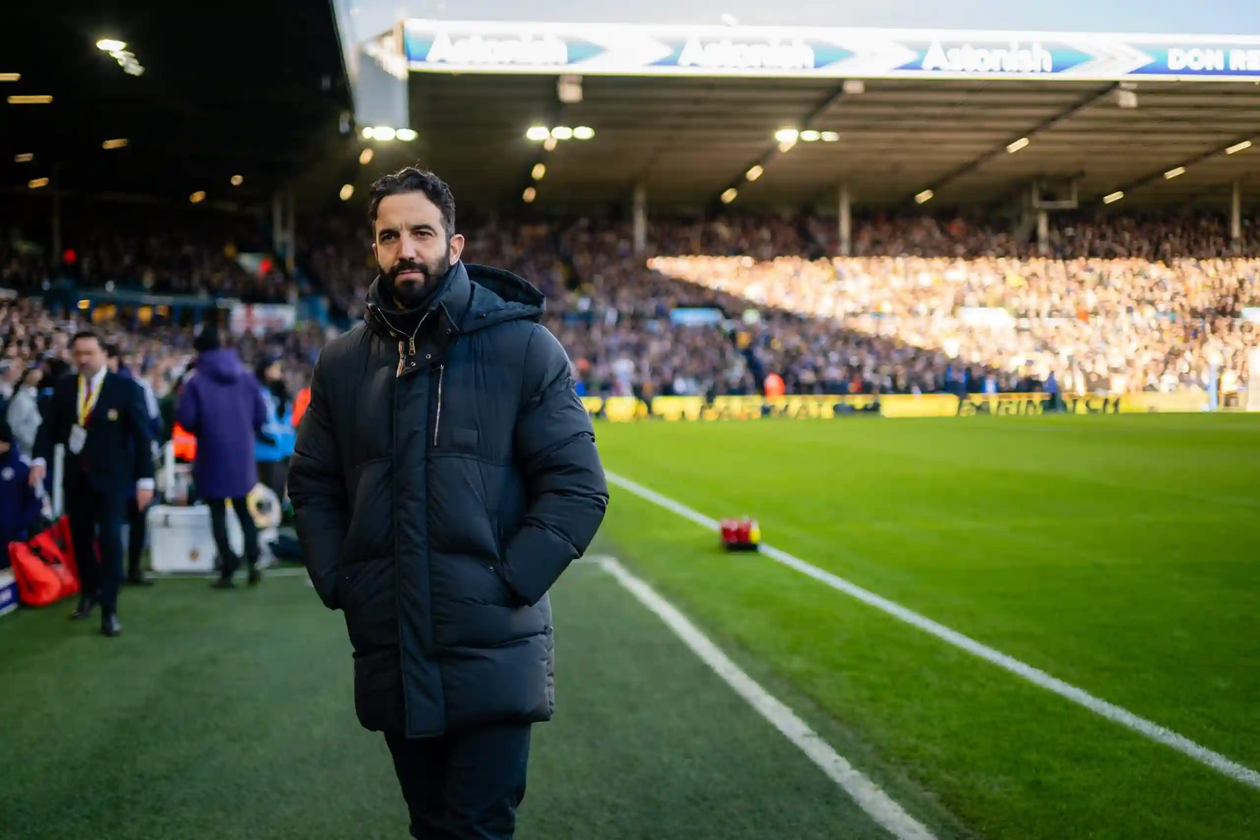 Ruben Amorim walks along the sideline at Old Trafford before kickoff.