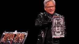 Nvidia CEO Jensen Huang holds a Vera Rubin AI computing module during a CES 2026 presentation.