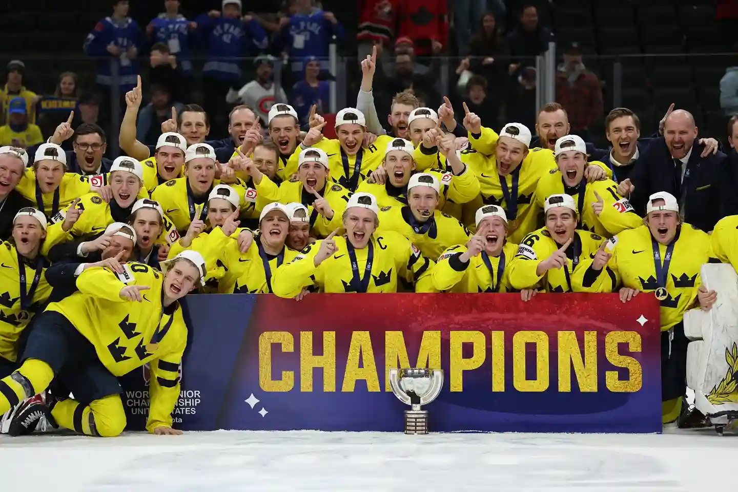 Sweden’s World Junior team poses together on the ice after winning the championship.
