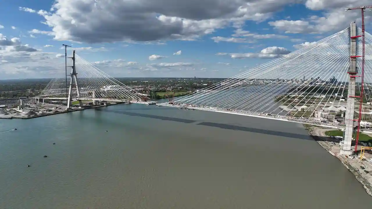 President Donald Trump speaking at a podium during a public appearance, gesturing while addressing an audience.