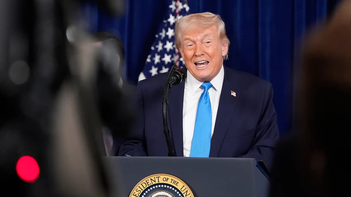 President Donald Trump speaks at a podium during a formal announcement on U.S. energy and foreign policy
