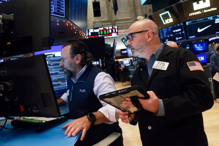 Traders working on the floor of the New York Stock Exchange amid fluctuating market conditions